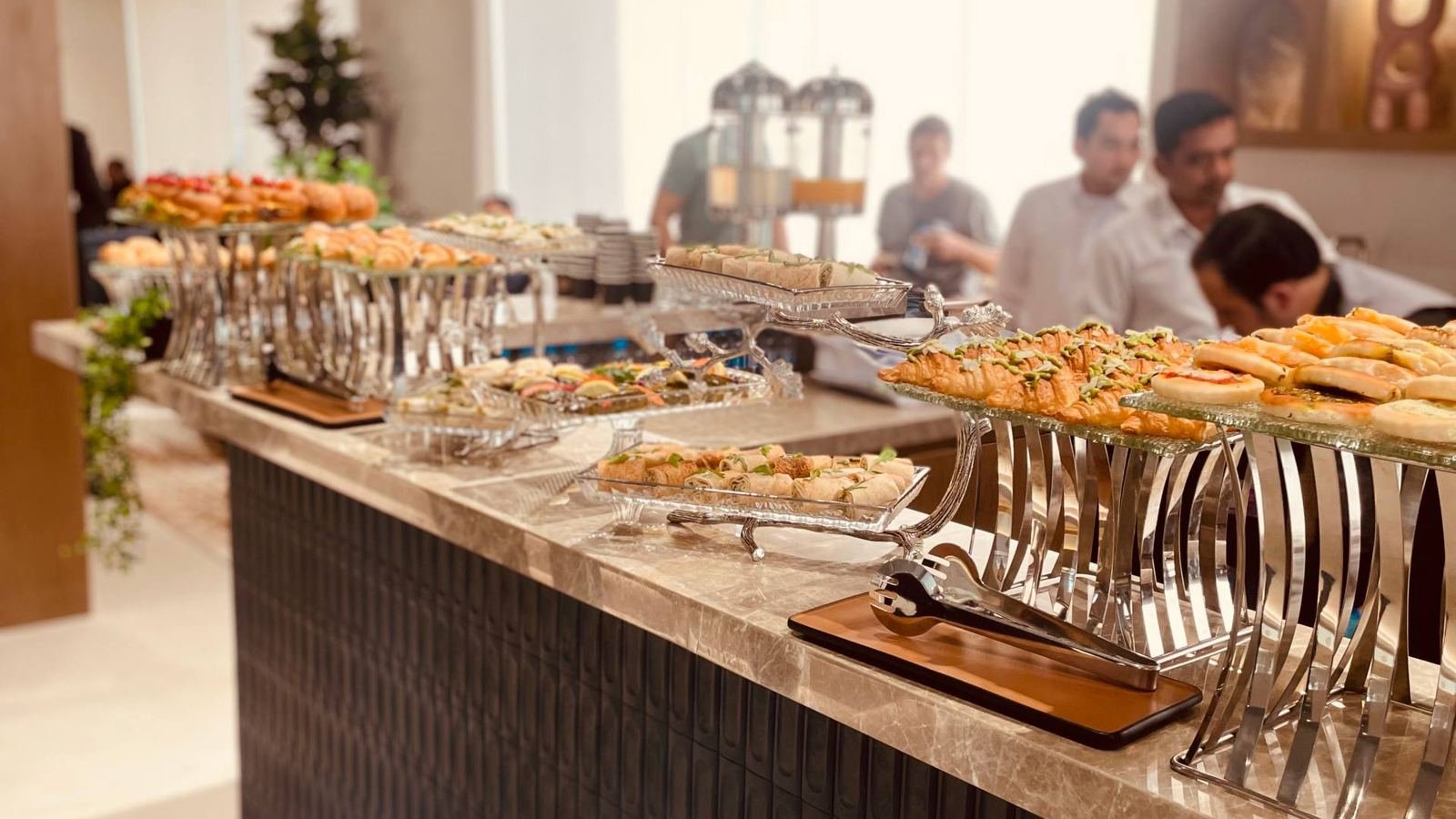 Dana Prime team serving a full buffet counter to guests at a corporate event